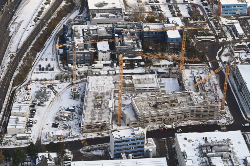 Berlin from above - Wintry snowy construction site to build a new office and commercial building INK Berlin - Inspire Neukoelln on Ballinstrasse - Woermannkehre in the district Neukoelln in Berlin, Germany