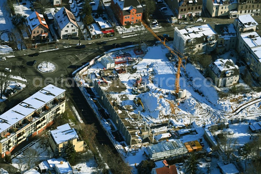 Aerial image Berlin - Wintry snowy new construction of the building complex of the LIDL - shopping center on street Giesestrasse corner Hoenoer Strasse in the district Mahlsdorf in Berlin, Germany