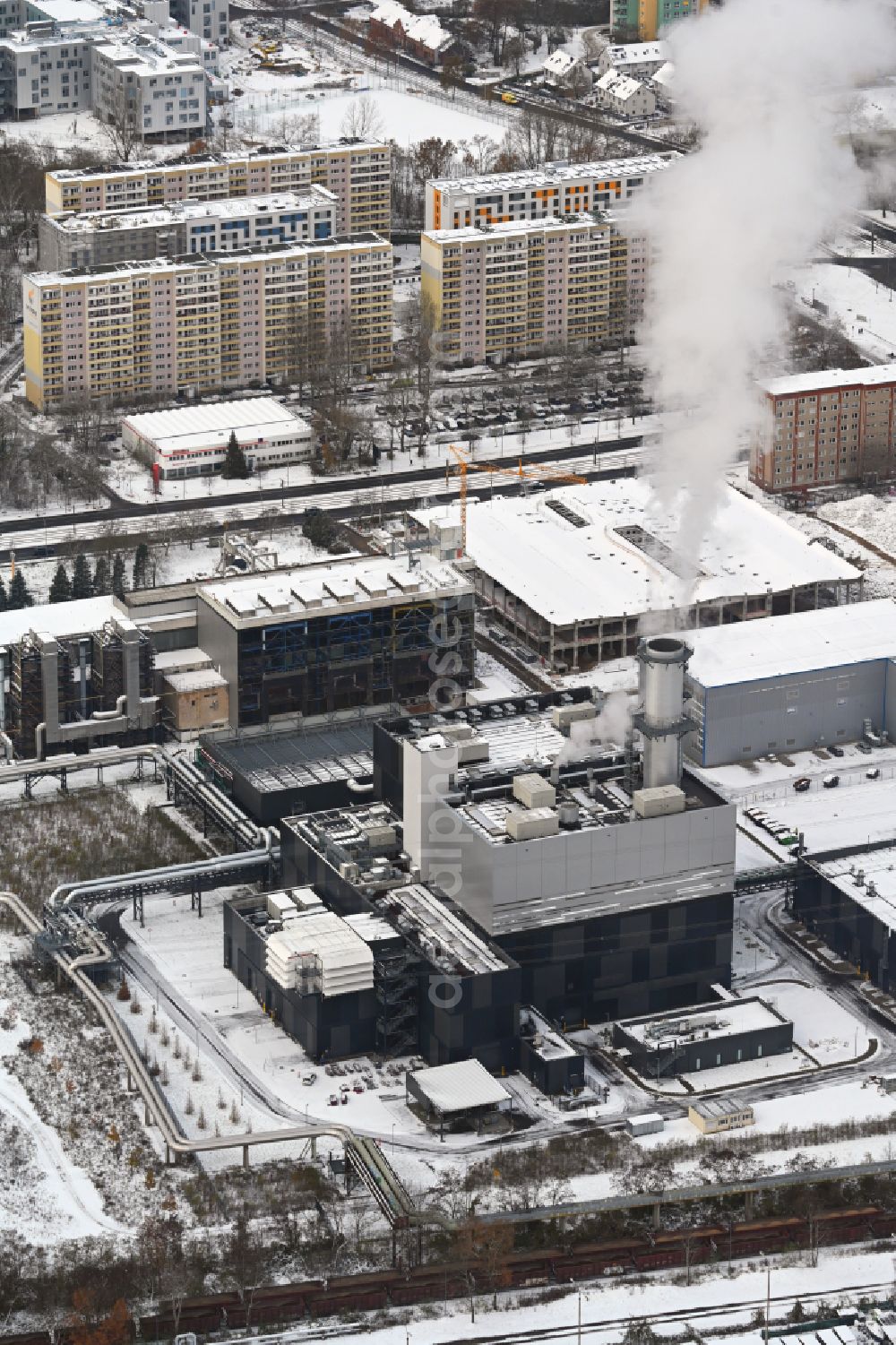 Berlin from the bird's eye view: Wintry snowy power plants and exhaust towers of thermal power station - Kraft-Waerme-Kopplungsanlage on Rhinstrasse in the district Marzahn in Berlin, Germany