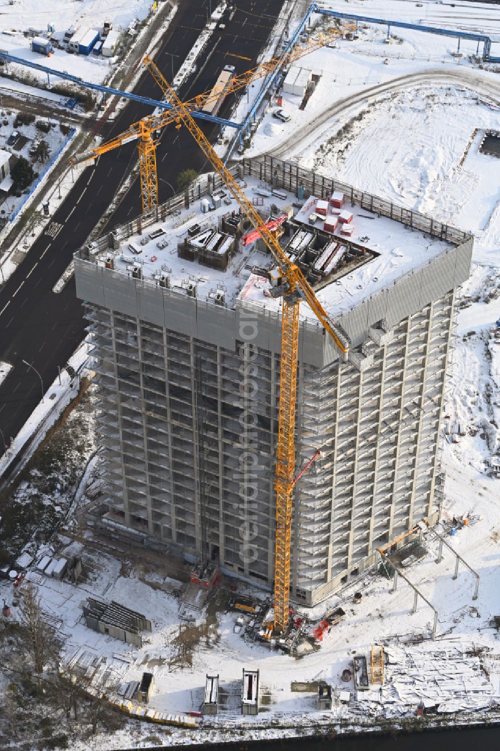 Berlin from above - Wintry snowy new construction high-rise construction site the hotel complex Estrel Tower on street Sonnenallee in the district Neukoelln in Berlin, Germany
