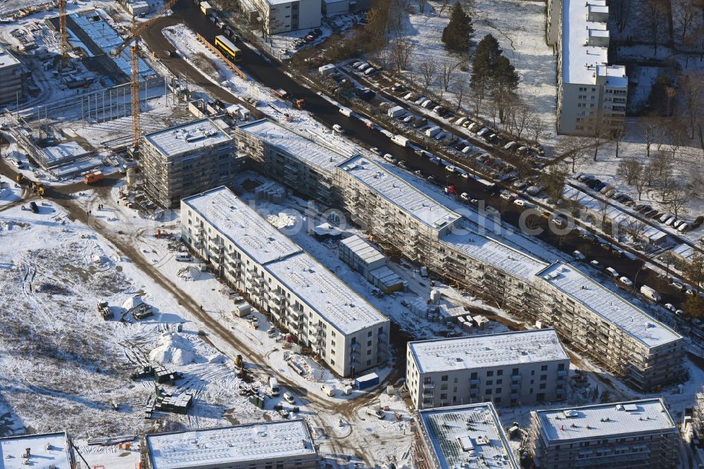 Berlin from above - Wintry snowy construction site to build a new multi-family residential complex Buckower Felder on street Gerlinger Strasse in the district Buckow in Berlin, Germany