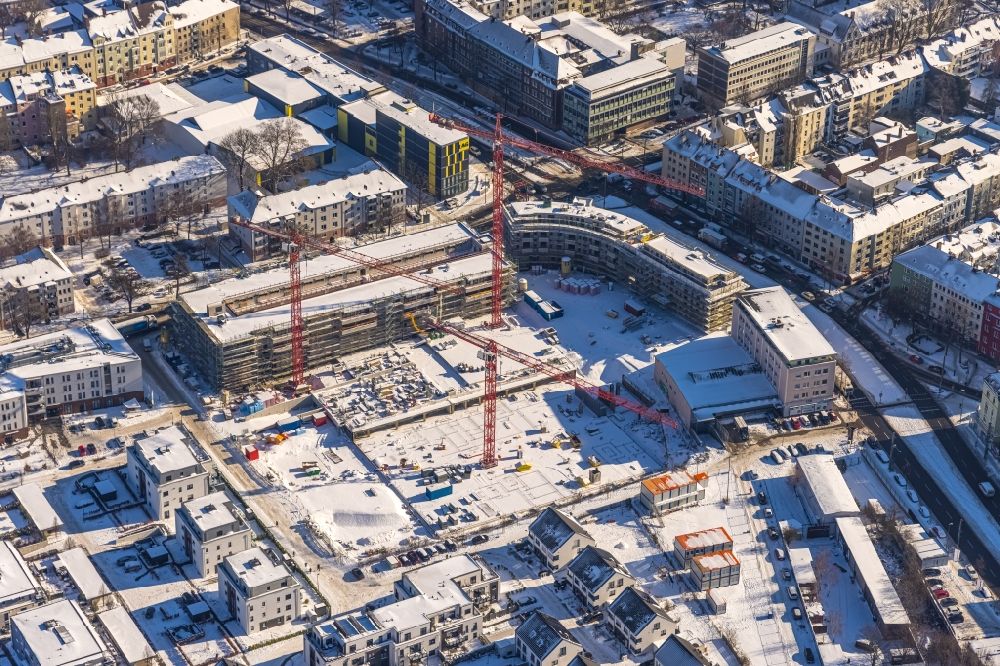 Dortmund from above - Wintry snowy construction site to build a new multi-family residential complex Kaiser-Quartier on Kloennestrasse in Dortmund in the state North Rhine-Westphalia, Germany