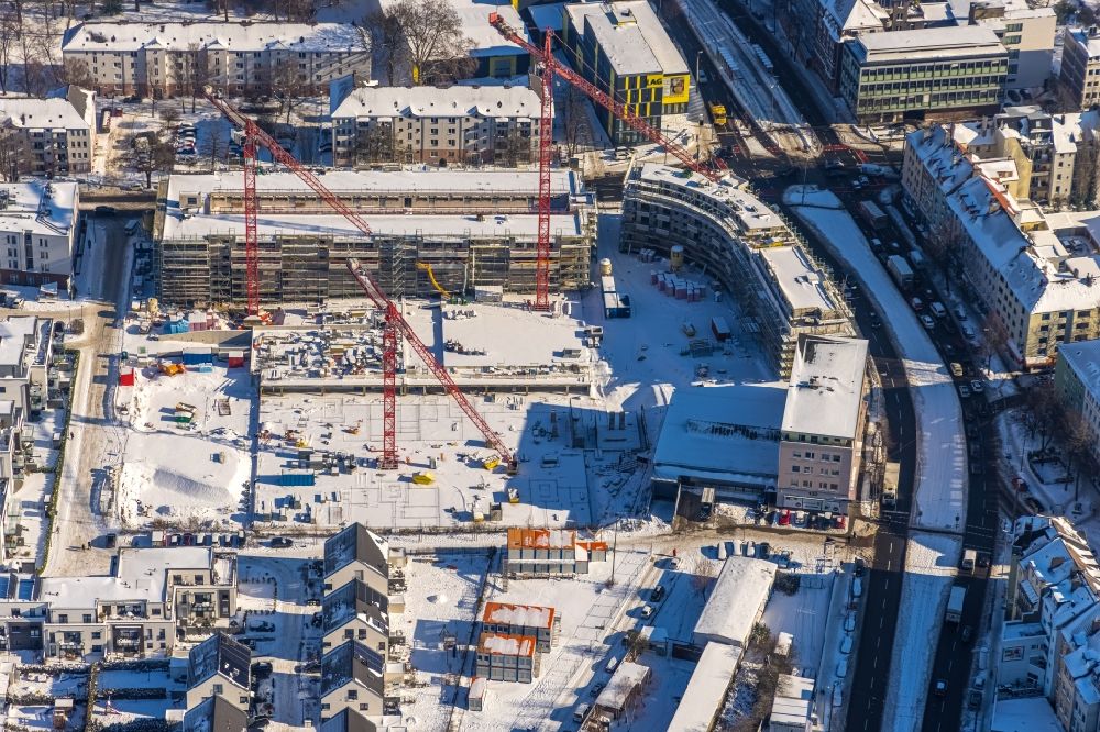 Dortmund from the bird's eye view: Wintry snowy construction site to build a new multi-family residential complex Kaiser-Quartier on Kloennestrasse in Dortmund in the state North Rhine-Westphalia, Germany