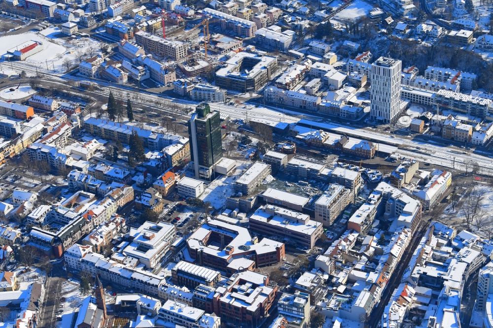 Aerial image Lörrach - Wintry snowy new residential and commercial building Quarter Loe on place Bahnhofsplatz - Sarasinweg - Palmstrasse in Loerrach in the state Baden-Wurttemberg, Germany