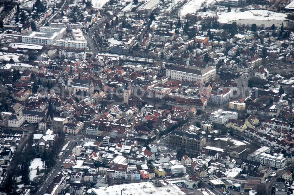 Ettlingen from above - Wintry snowy Town View of the streets and houses of the residential areas in Ettlingen in the state Baden-Wuerttemberg