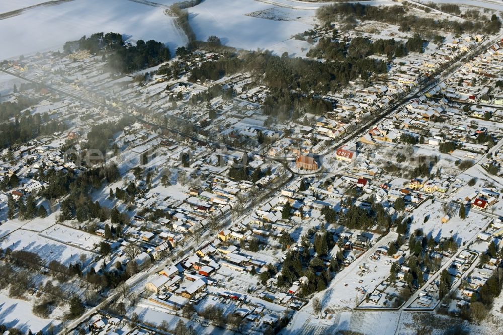 Marienwerder from the bird's eye view: Wintry snowy town View of the streets and houses of the residential areas in Marienwerder in the state Brandenburg, Germany