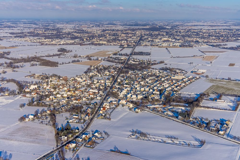 Aerial image Ampen - Wintry snowy Village view on the edge of agricultural fields and land in Ampen at Ruhrgebiet in the state North Rhine-Westphalia, Germany