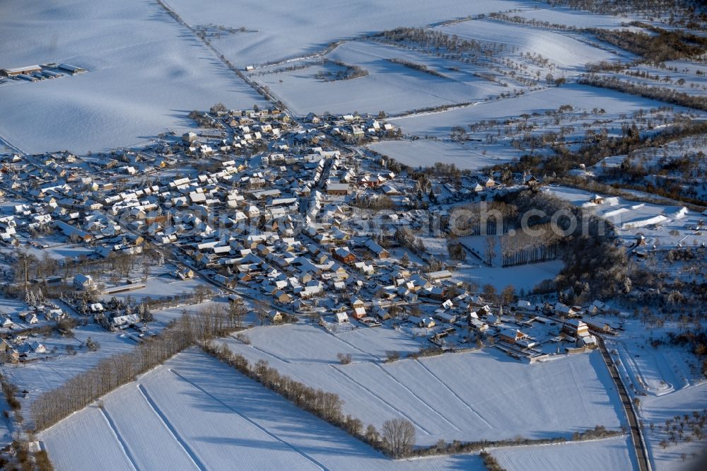 Aerial image Tilleda - Wintry snowy town View of the streets and houses in Tilleda in the state Saxony-Anhalt, Germany