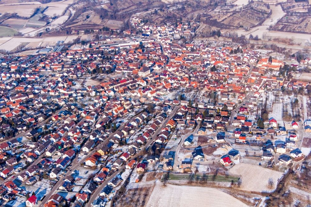 Aerial image Unteröwisheim - Wintry snowy Town View of the streets and houses of the residential areas in Unteroewisheim in the state Baden-Wurttemberg, Germany