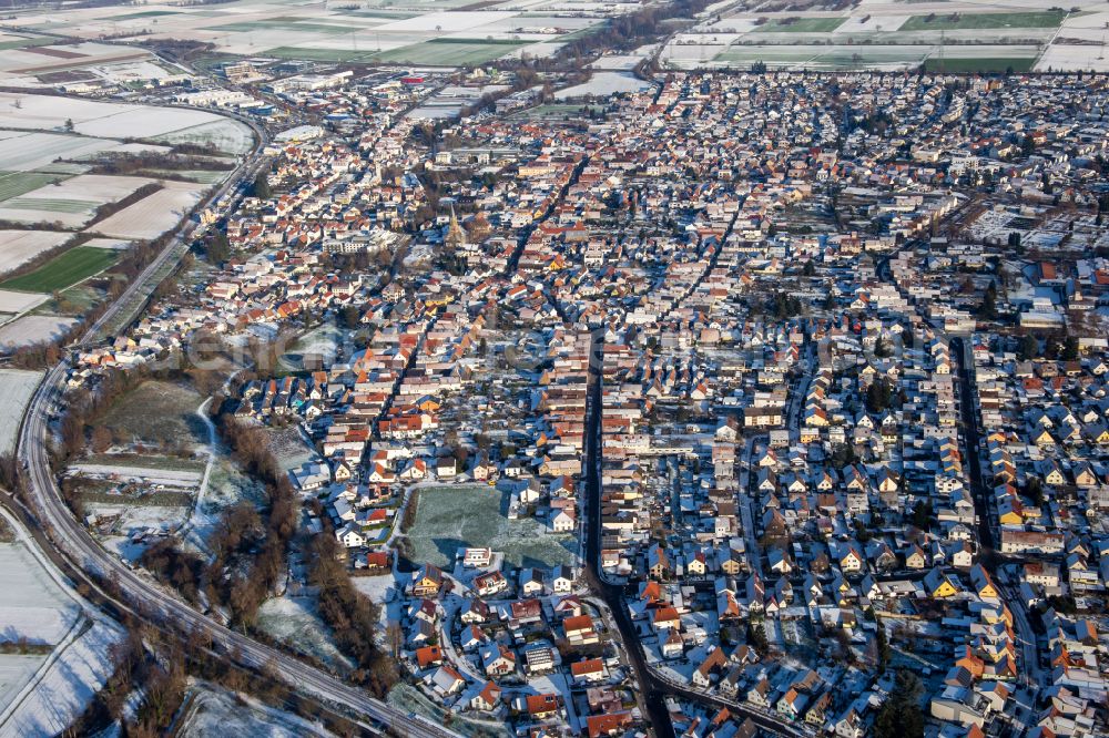 Aerial image Rülzheim - Wintry snowy town View of the streets and houses of the residential areas from the West in Ruelzheim in the state Rhineland-Palatinate, Germany