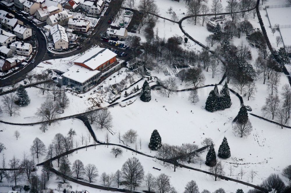 Reichenbach from above - Wintry snowy Park of Kurpark with Herzog Kaffee in Reichenbach in the state Baden-Wurttemberg, Germany