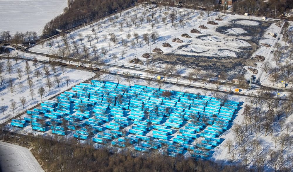 Aerial image Düsseldorf - Wintry snowy parking and storage space for automobiles on Lotzweg with Amazon Prime truck trailers on Messegelaende in Duesseldorf at Ruhrgebiet in the state North Rhine-Westphalia, Germany