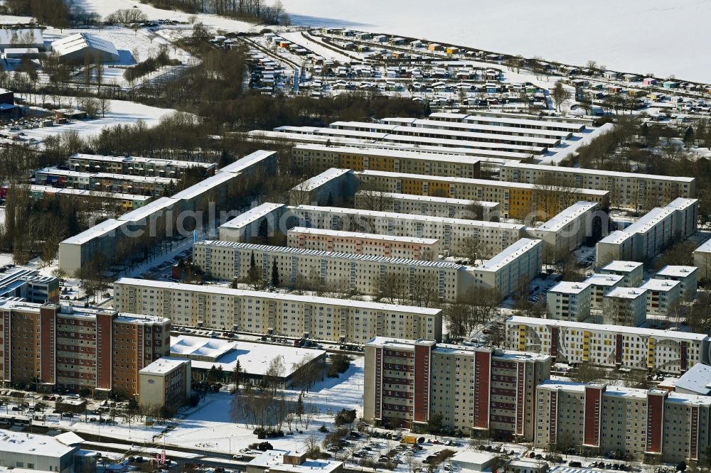 Stralsund from above - Wintry snowy skyscrapers in the residential area of industrially manufactured settlement on Heinrich-Heine-Ring in Stralsund in the state Mecklenburg - Western Pomerania, Germany