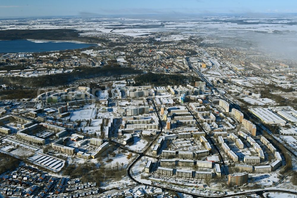 Neubrandenburg from above - Wintry snowy skyscrapers in the residential area of industrially manufactured settlement Oststadt in Neubrandenburg in the state Mecklenburg - Western Pomerania, Germany