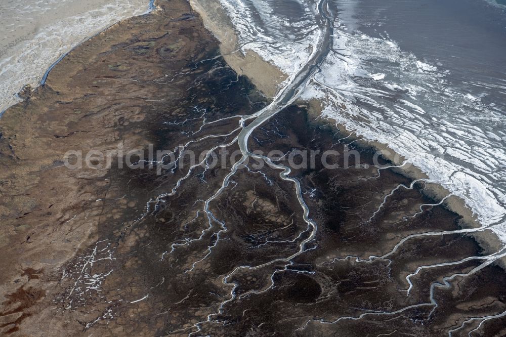Aerial image Spiekeroog - Wintry snowy formation of tides in the Wadden Sea landscape of North Sea in Spiekeroog in the state Lower Saxony, Germany