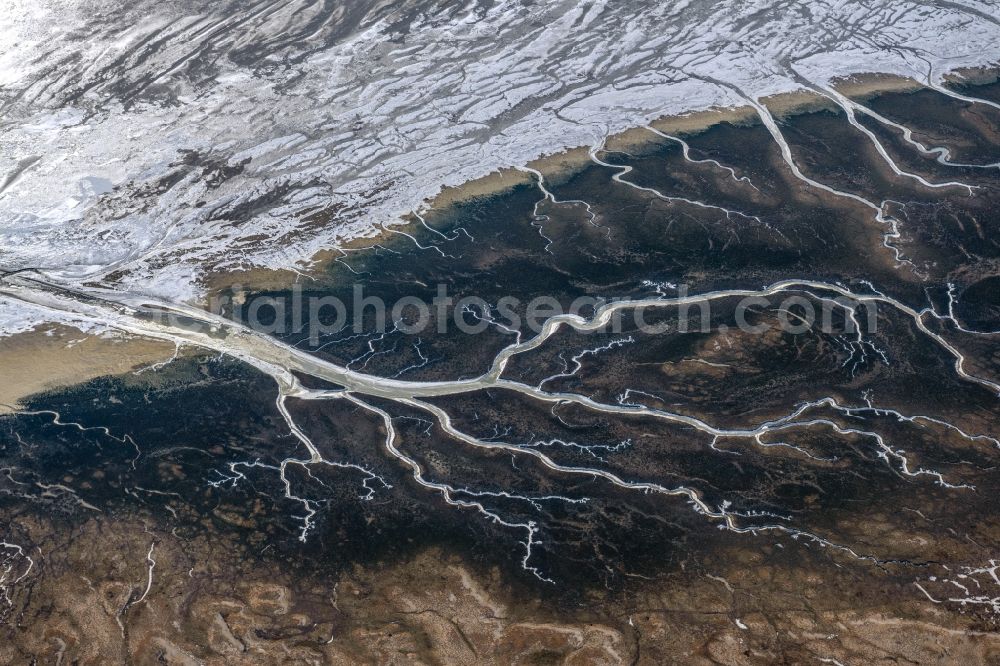 Spiekeroog from above - Wintry snowy formation of tides in the Wadden Sea landscape of North Sea in Spiekeroog in the state Lower Saxony, Germany