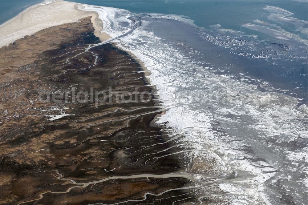 Spiekeroog from the bird's eye view: Wintry snowy formation of tides in the Wadden Sea landscape of North Sea in Spiekeroog in the state Lower Saxony, Germany