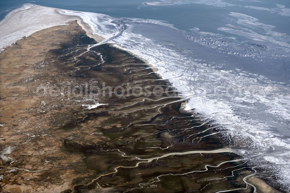 Aerial image Spiekeroog - Wintry snowy formation of tides in the Wadden Sea landscape of North Sea in Spiekeroog in the state Lower Saxony, Germany