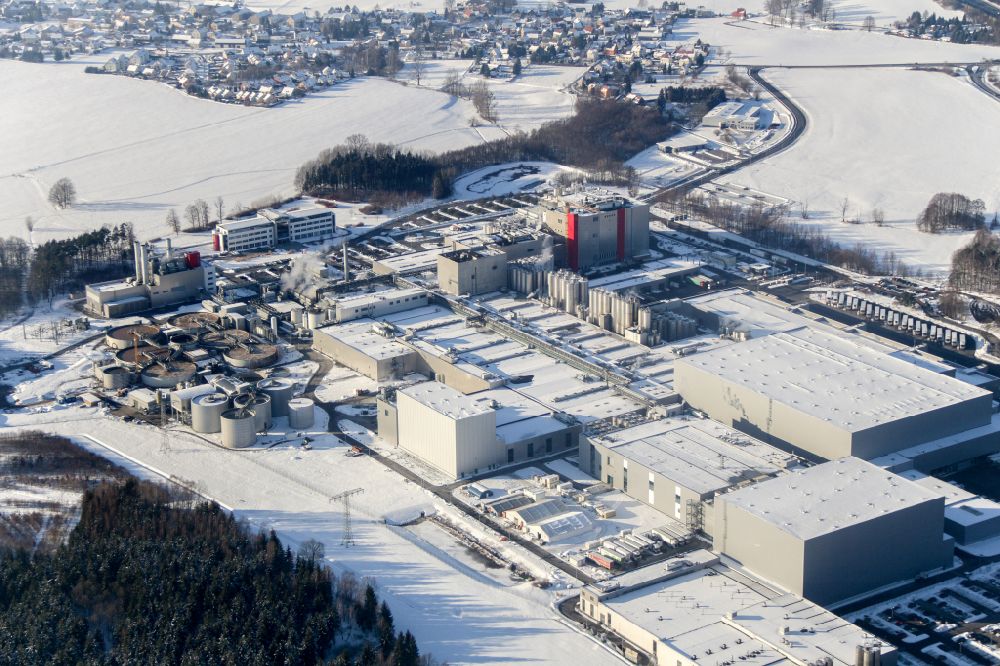 Wachau from the bird's eye view: Wintry snowy Production site of the company Sachsenmilch in the district Leppersdorf in Wachau in the state Saxony