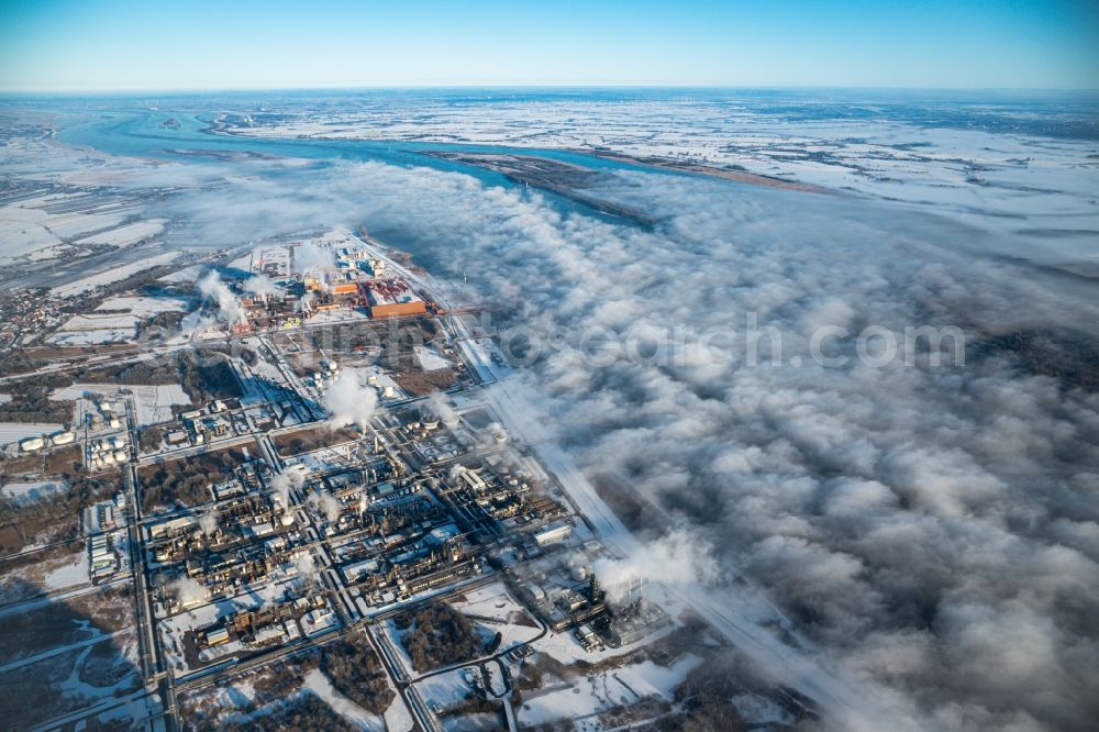 Stade from the bird's eye view: Wintry snowy refinery equipment and management systems on the factory premises of the chemical manufacturers of Fa. Dow Chemical Olin in Stade in the state Lower Saxony, Germany