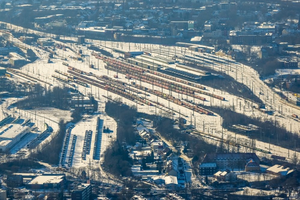 Herne from above - Wintry snowy tracks and rails at the Wanne-Eickel main station and the freight yard - marshalling yard of the Deutsche Bahn in Herne in the Ruhr area in the state of North Rhine-Westphalia