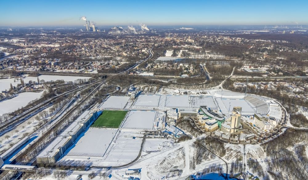 Gelsenkirchen from above - Wintry snowy ensemble of sports grounds of FC Gelsenkirchen-Schalke 04 e.V. between the Ernst-Kuzorra-Weg and of the Parkallee in the district Gelsenkirchen-Ost in Gelsenkirchen at Ruhrgebiet in the state North Rhine-Westphalia, Germany