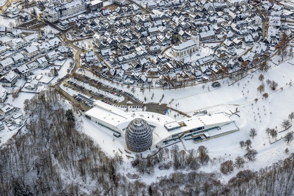 Winterberg from the bird's eye view: Wintry snowy city view on down town in Winterberg at Sauerland in the state North Rhine-Westphalia, Germany