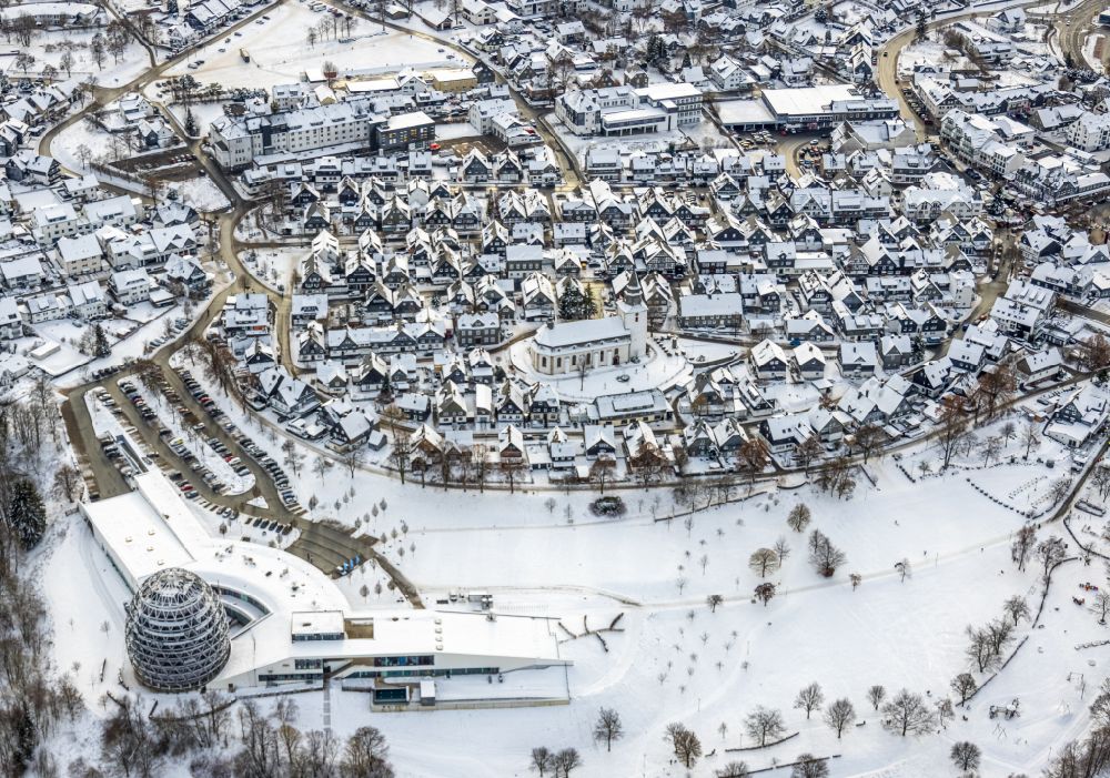 Aerial image Winterberg - Wintry snowy city view on down town in Winterberg at Sauerland in the state North Rhine-Westphalia, Germany