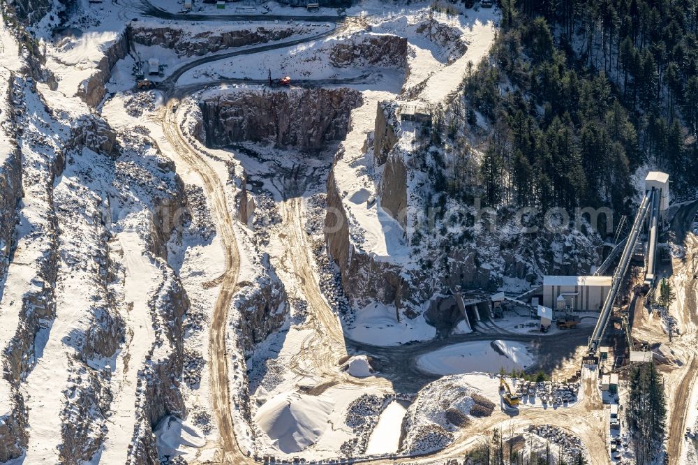 Seebach from the bird's eye view: Wintry snowy quarry for the mining and handling of Granit in Seebach in the state Baden-Wurttemberg, Germany