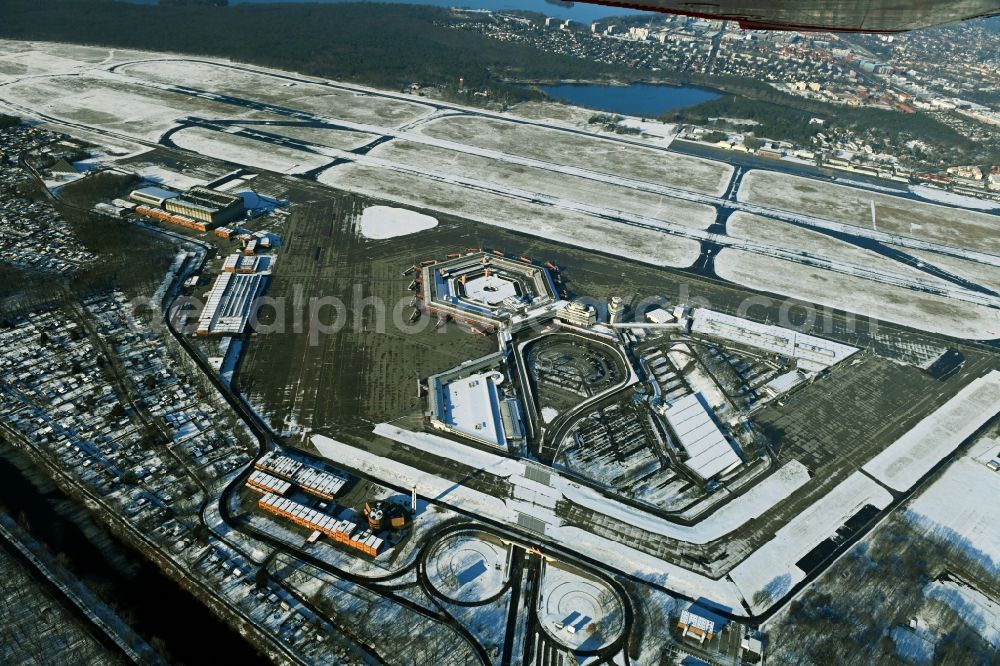 Aerial image Berlin - Wintry snowy end of flight operations at the terminal of the airport Berlin - Tegel