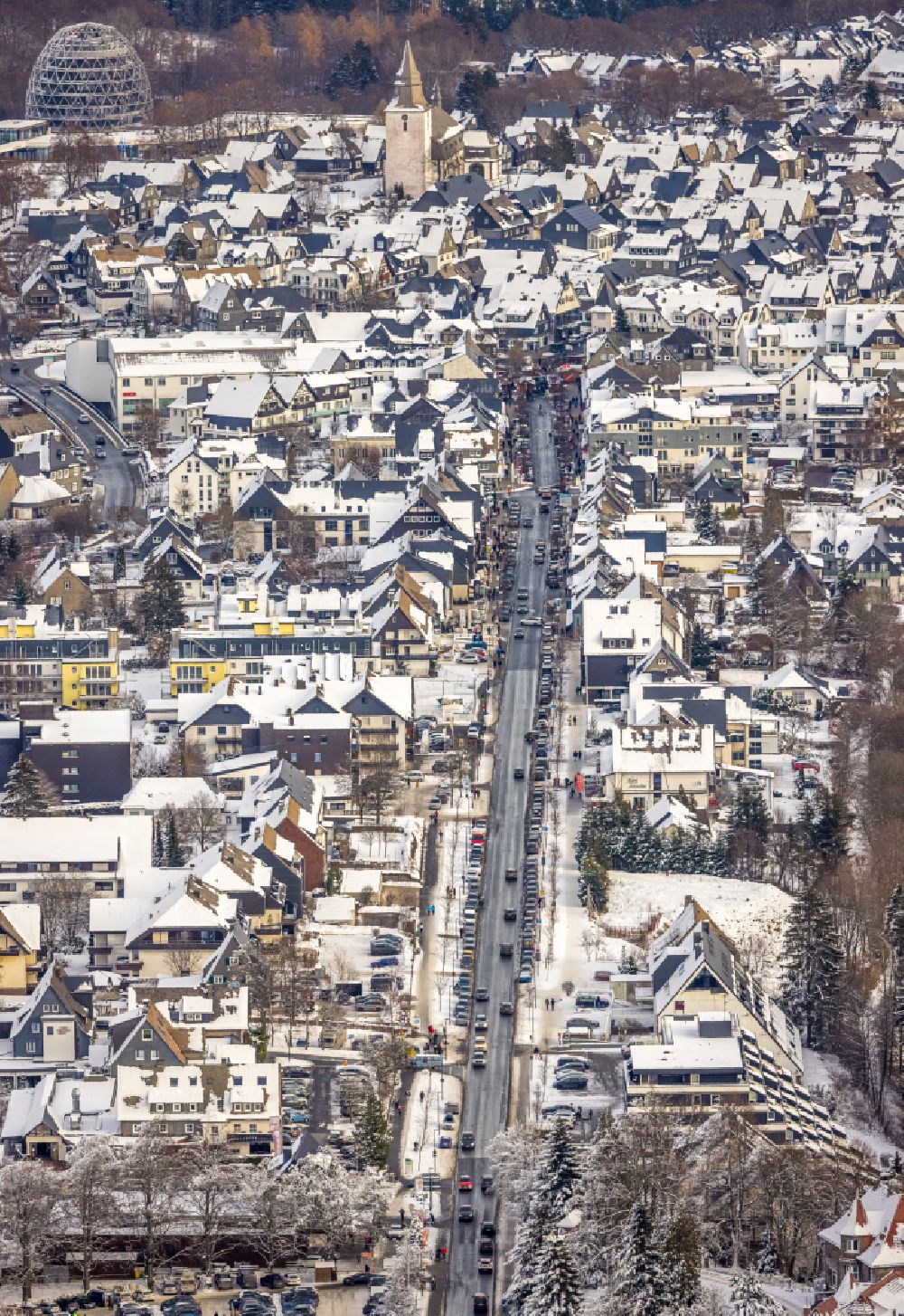 Aerial image Winterberg - Wintry snowy street guide of famous promenade and shopping street on street Am Waltenberg in Winterberg at Sauerland in the state North Rhine-Westphalia, Germany