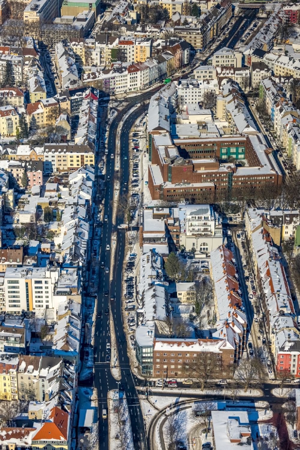 Dortmund from the bird's eye view: Wintry snowy street - road guidance Hohe Strasse overlooking the Telekom company administration building in the district Westfalenhalle in Dortmund at Ruhrgebiet in the state North Rhine-Westphalia, Germany