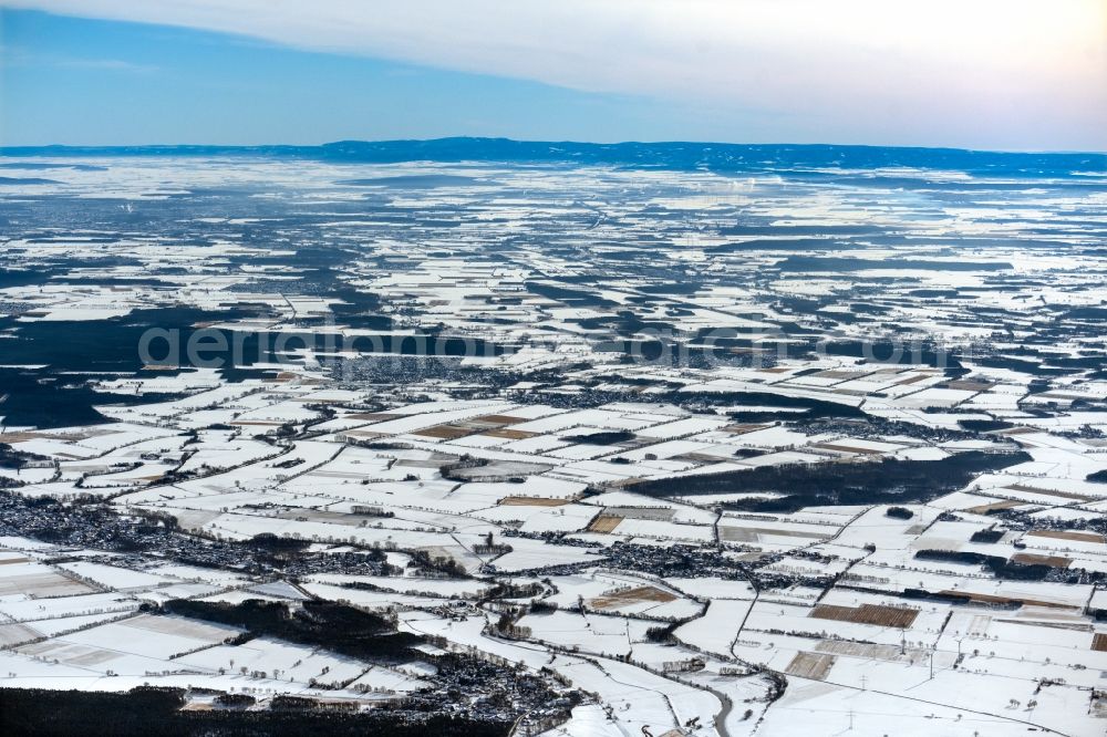 Hoyershausen from the bird's eye view: Wintry snowy structures on agricultural fields in Hoyershausen in the state Lower Saxony, Germany