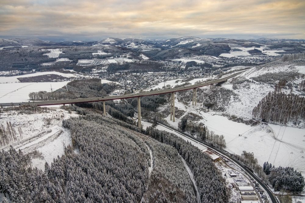 Aerial image Nuttlar - Wintry snowy the Talbruecke Nuttlar of the federal motorway BAB 46 near Nuttlar is the highest bridge in North Rhine-Westphalia with a height of 115 meters