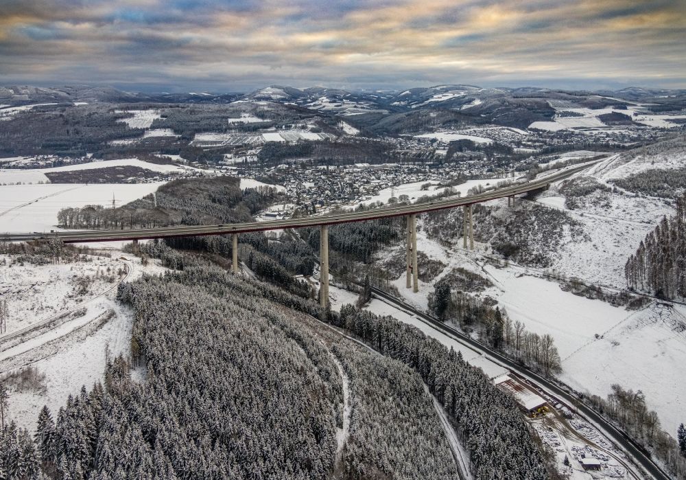 Aerial photograph Nuttlar - Wintry snowy the Talbruecke Nuttlar of the federal motorway BAB 46 near Nuttlar is the highest bridge in North Rhine-Westphalia with a height of 115 meters
