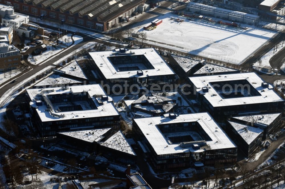 Aerial photograph Hennigsdorf - Wintry snowy grounds of the Blue Wonder Technology Center in Hennigsdorf in Brandenburg. The technology park Hennigsdorf North offers a business park land for commercial, industrial, service and production