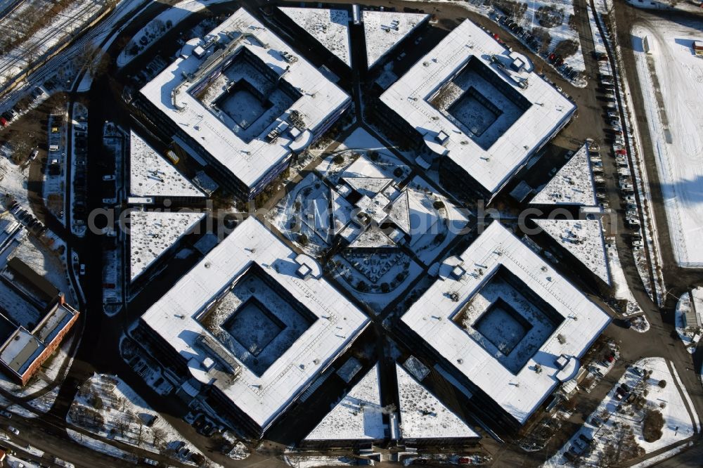Aerial image Hennigsdorf - Wintry snowy grounds of the Blue Wonder Technology Center in Hennigsdorf in Brandenburg. The technology park Hennigsdorf North offers a business park land for commercial, industrial, service and production