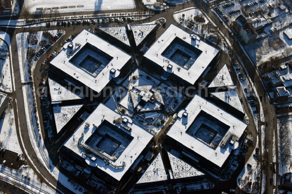 Hennigsdorf from the bird's eye view: Wintry snowy grounds of the Blue Wonder Technology Center in Hennigsdorf in Brandenburg. The technology park Hennigsdorf North offers a business park land for commercial, industrial, service and production