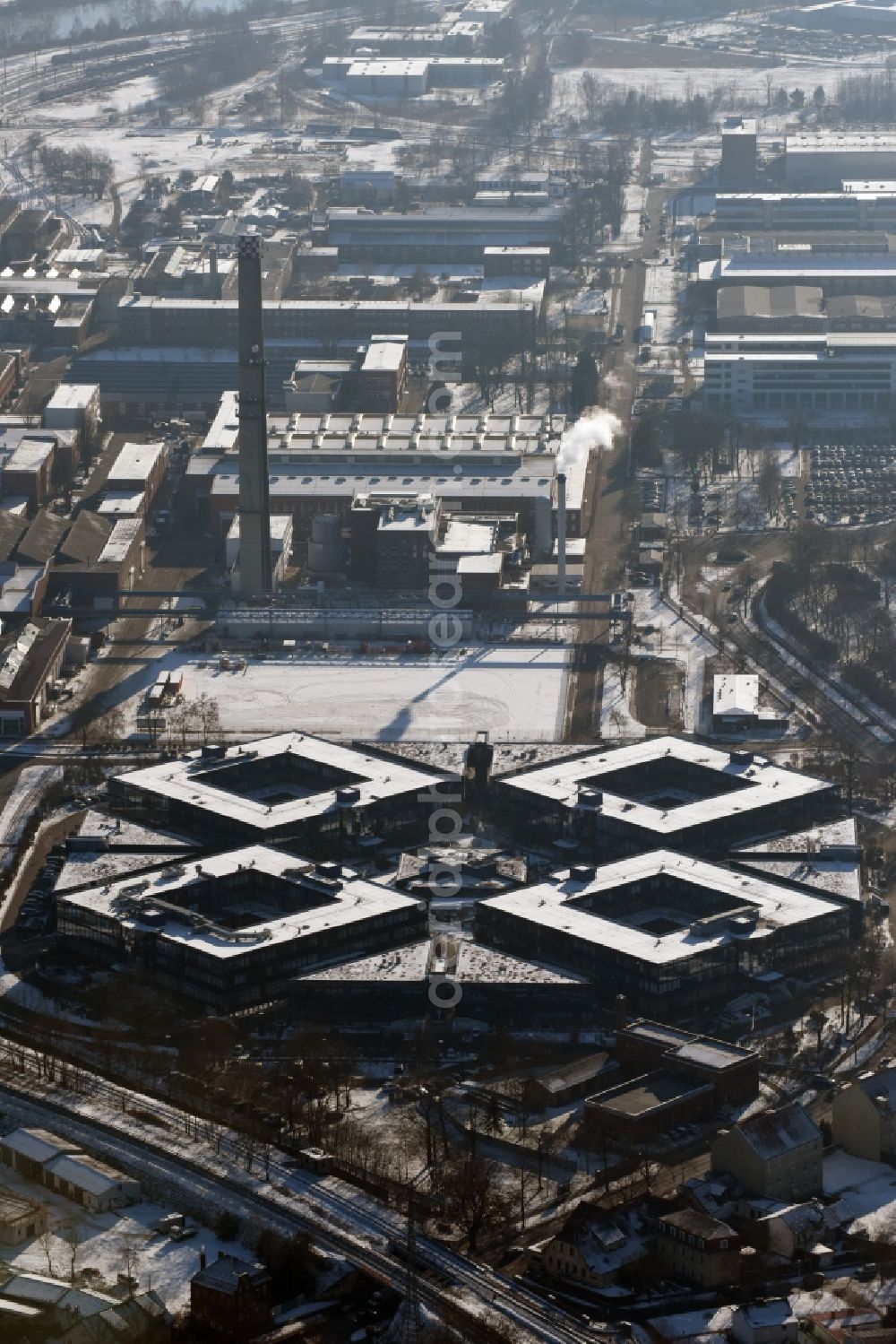 Aerial image Hennigsdorf - Wintry snowy grounds of the Blue Wonder Technology Center in Hennigsdorf in Brandenburg. The technology park Hennigsdorf North offers a business park land for commercial, industrial, service and production