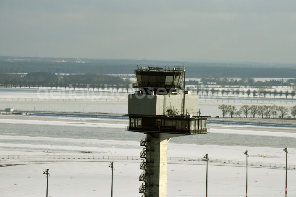 Schönefeld from above - Wintry snowy tower of DFS German Air Traffic Control GmbH on the runways of the BER Airport in Schoenefeld in Brandenburg