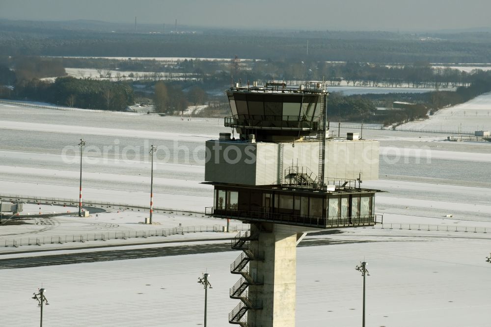 Aerial image Schönefeld - Wintry snowy tower of DFS German Air Traffic Control GmbH on the runways of the BER Airport in Schoenefeld in Brandenburg