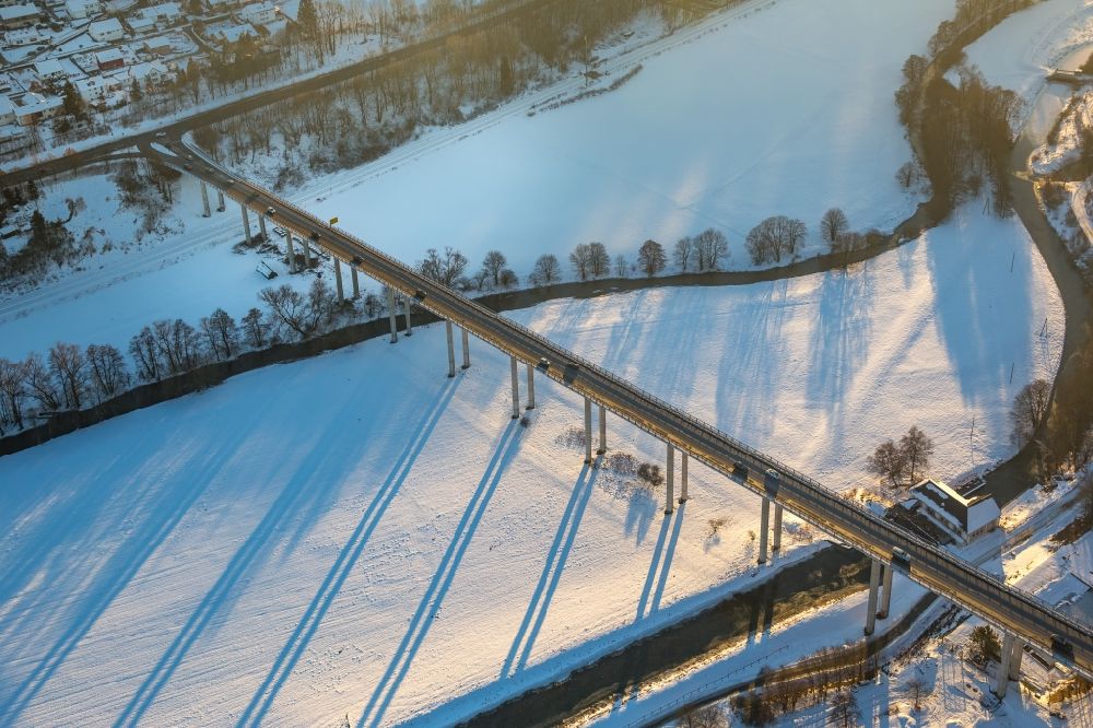 Bestwig from the bird's eye view: Wintry snowy Riparian zones on the course of the river the Ruhr in the district Velmede in Bestwig in the state North Rhine-Westphalia