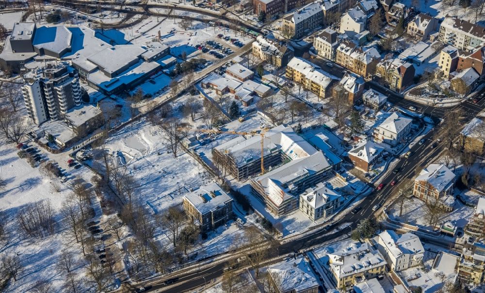 Bommern from the bird's eye view: Wintry snowy reconstruction and renovation of the factory site of the old factory to a residential area with city lofts on Ruhrstrasse in Bommern at Ruhrgebiet in the state North Rhine-Westphalia, Germany