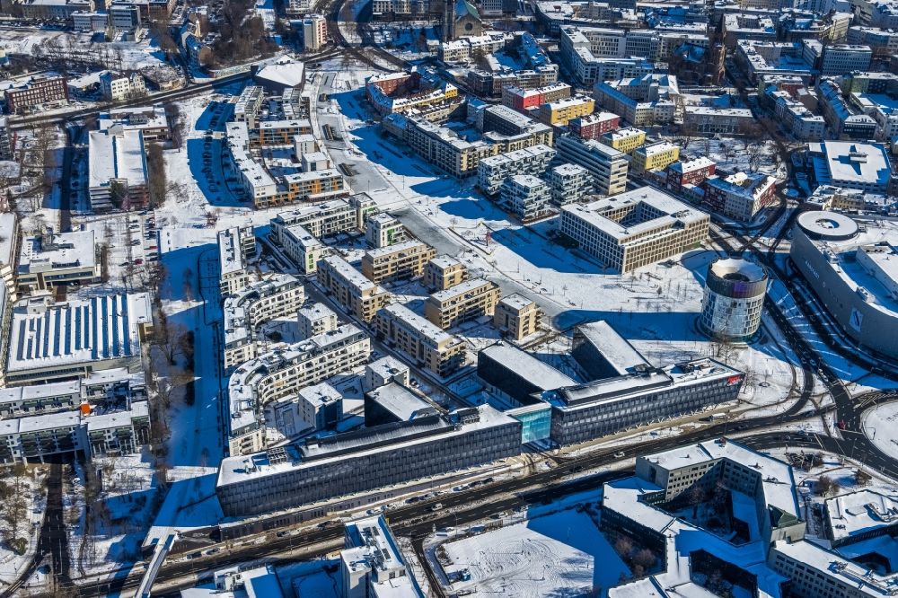 Essen from above - Wintry snowy administration building of the company of Funke Mediengruppe on Berliner Platz in Essen in the state North Rhine-Westphalia, Germany