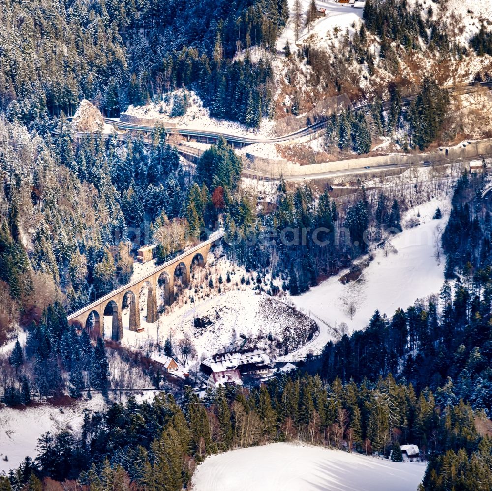 Breitnau from above - Wintry snowy viaduct of the railway bridge structure to route the railway tracks in Breitnau in the state Baden-Wurttemberg, Germany