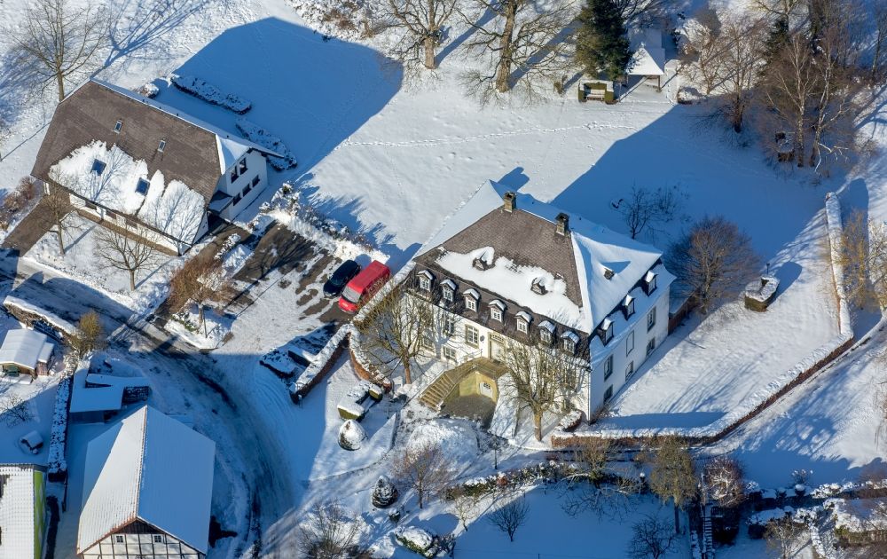 Aerial photograph Brilon - Wintry snowy Luxury villa in residential area of single-family settlement in the district Scharfenberg in Brilon in the state North Rhine-Westphalia