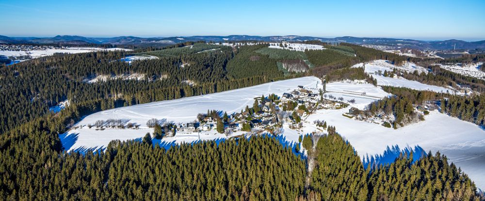 Winterberg from the bird's eye view: Wintry snowy forest and mountain scenery Kahler Asten on street Rothaarsteig in Winterberg in the state North Rhine-Westphalia, Germany