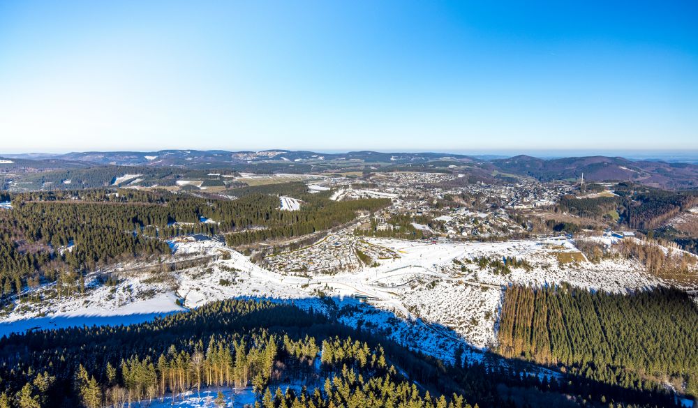 Aerial photograph Winterberg - Wintry snowy forest and mountain scenery Kahler Asten on street Rothaarsteig in Winterberg in the state North Rhine-Westphalia, Germany