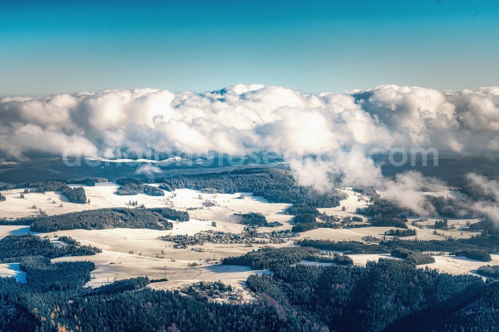 Aerial image Breitnau - Wintry snowy surrounded by forest and forest areas center of the streets and houses and residential areas in Breitnau in the state Baden-Wurttemberg, Germany
