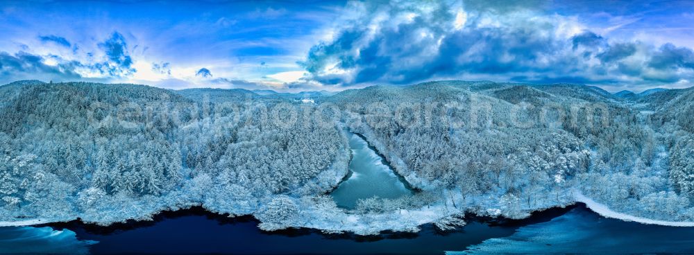 Aerial image Erlenbach bei Dahn - Wintry snowy forests on the shores of Lake Seehof - Fischweiher - Portzbach in Erlenbach bei Dahn in the state Rhineland-Palatinate, Germany